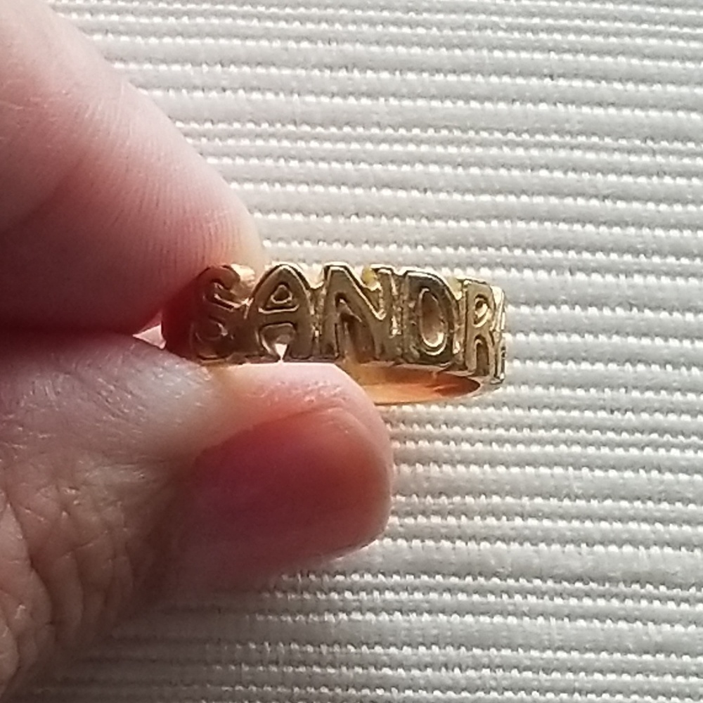 14k gold ring says - SANDRA